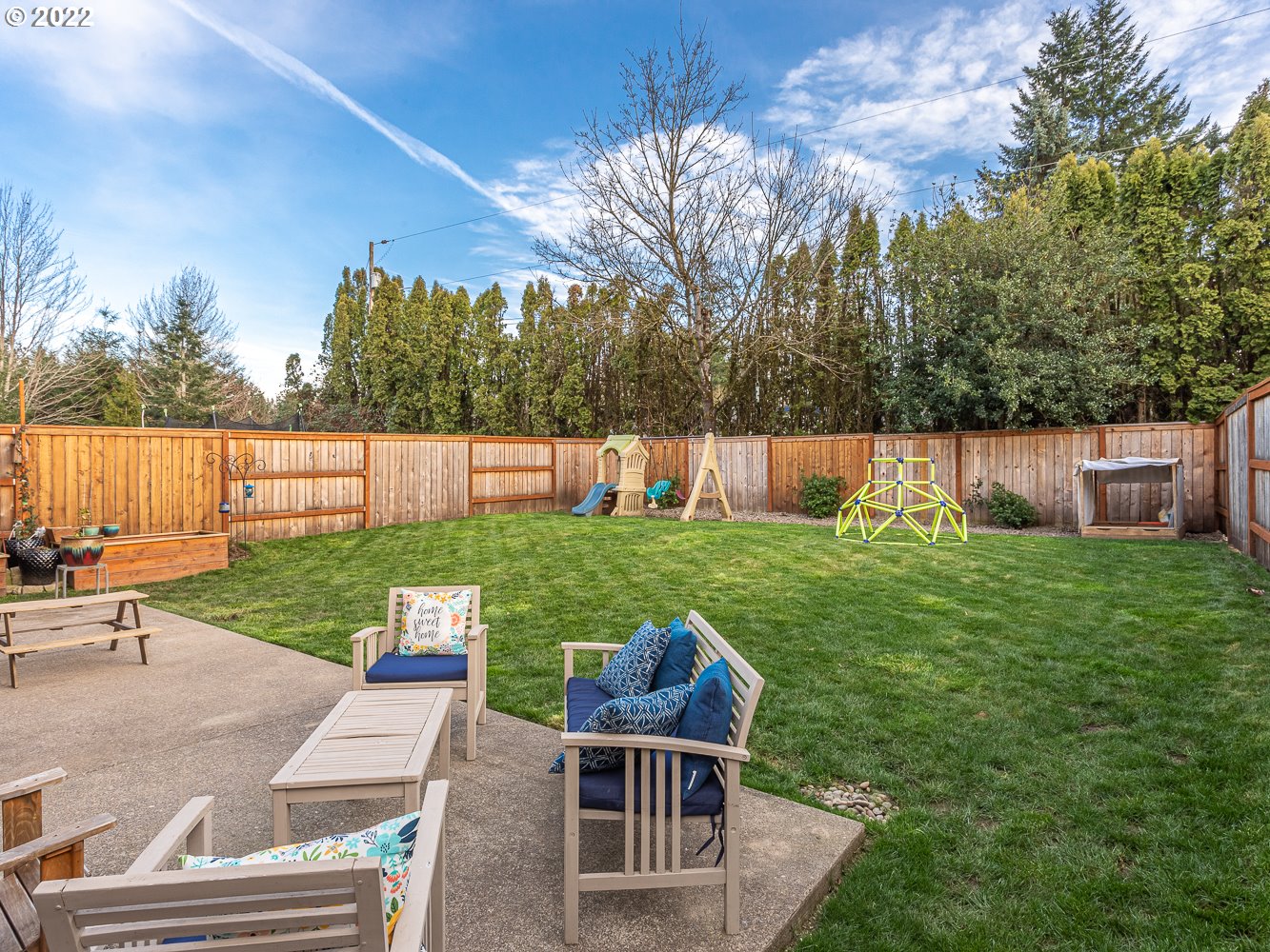 17656 Southeast Pinnacles Street Damascus, OR 97089 - Photo 28 of 31 a view of backyard with seating area and green space