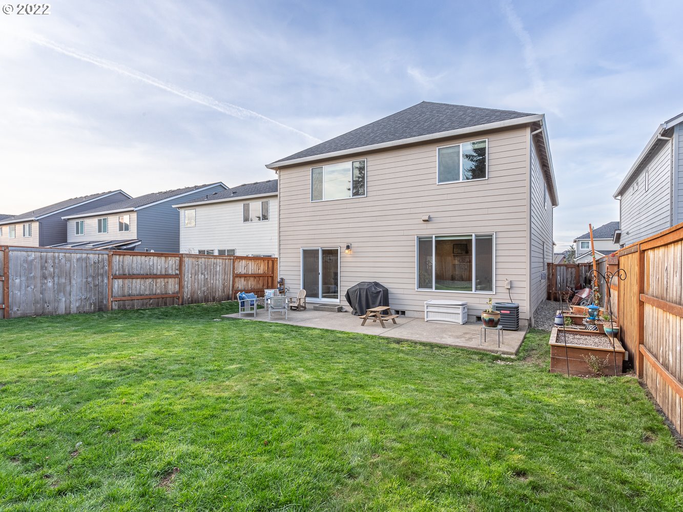 17656 Southeast Pinnacles Street Damascus, OR 97089 - Photo 29 of 31 a view of a backyard with sitting area and furniture