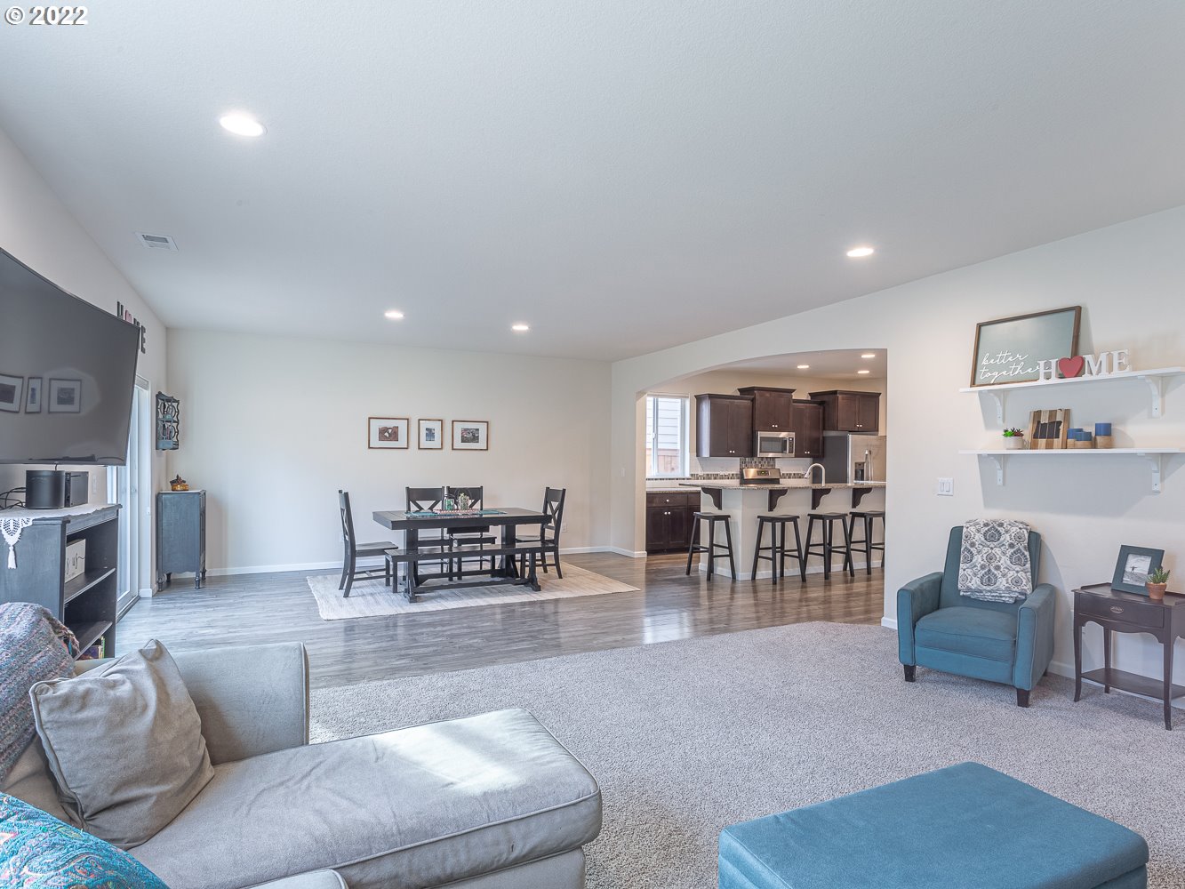 17656 Southeast Pinnacles Street Damascus, OR 97089 - Photo 10 of 31 a living room with furniture and view of kitchen
