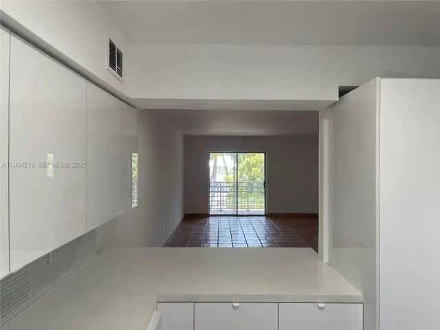 a view of a park with palm trees