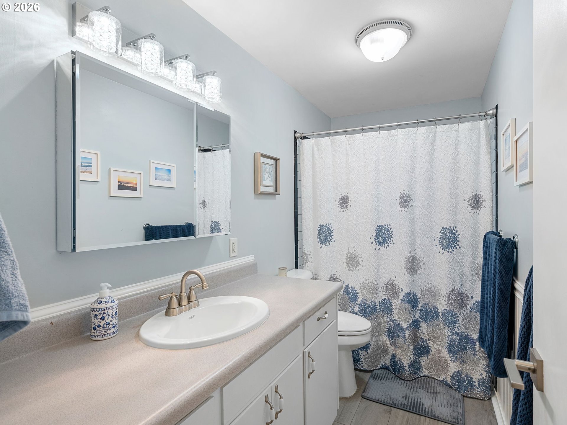 2036 Sallal Road Woodburn, OR 97071 - Photo 14 of 25 a bathroom with a granite countertop sink a toilet and a mirror