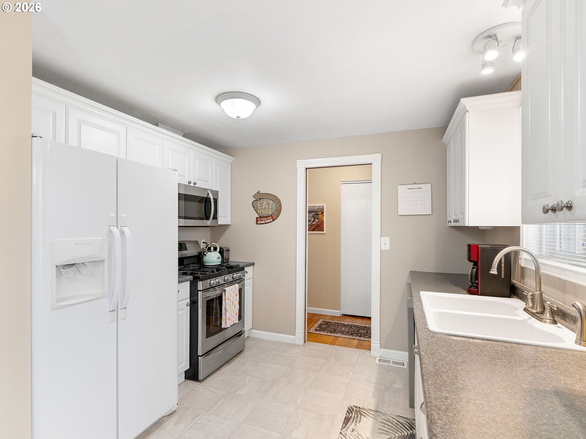 2036 Sallal Road Woodburn, OR 97071 - Photo 5 of 25 a kitchen with stainless steel appliances granite countertop a refrigerator and a sink