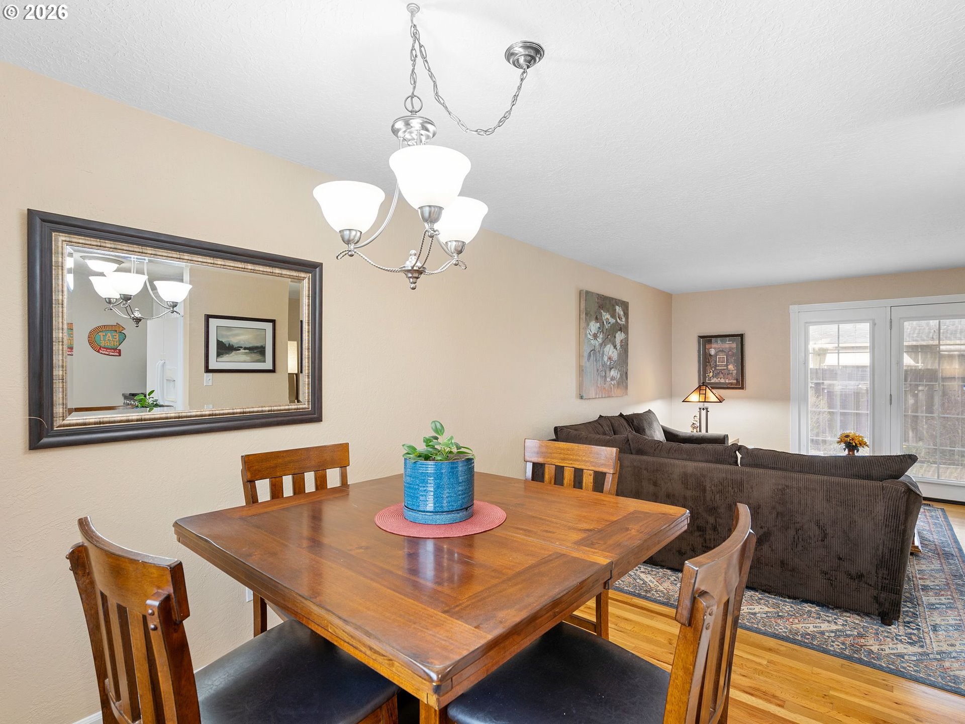 2036 Sallal Road Woodburn, OR 97071 - Photo 6 of 25 a view of a dining room with furniture and wooden floor