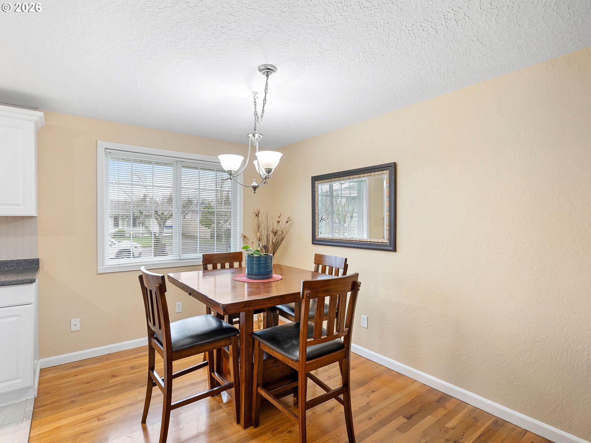 2036 Sallal Road Woodburn, OR 97071 - Photo 8 of 25 a view of a dining room with furniture wooden floor and chandelier