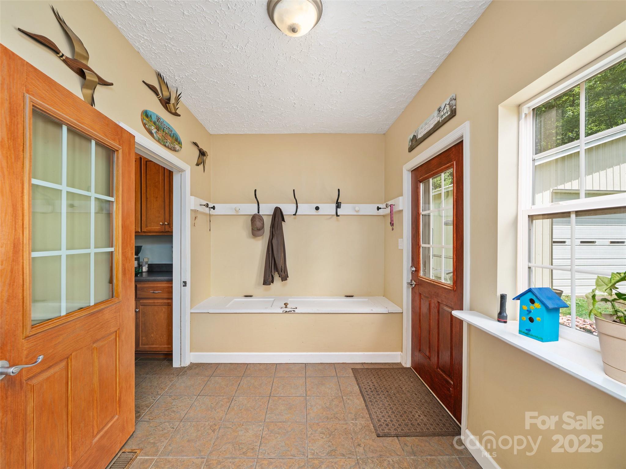 2216 Beans Creek Road Bakersville, NC 28705 - Photo 12 of 39 a bathroom with a tub and a sink