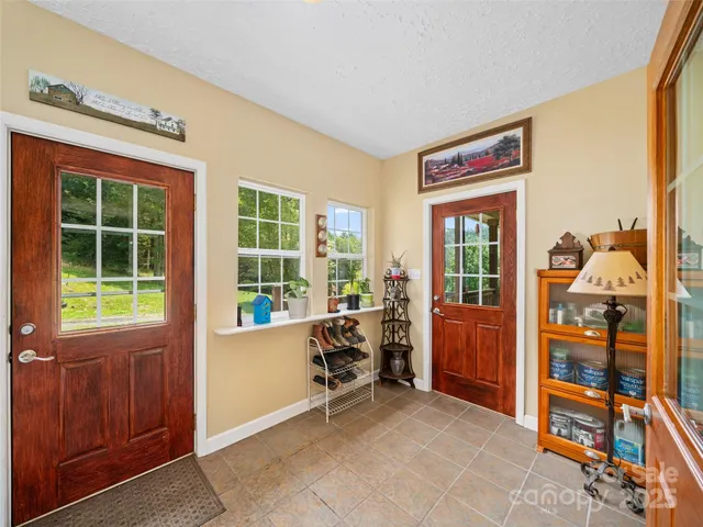 a view of a livingroom with furniture and windows