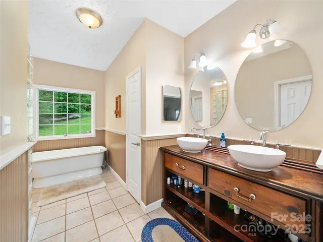 a bathroom with a sink a vanity and a mirror