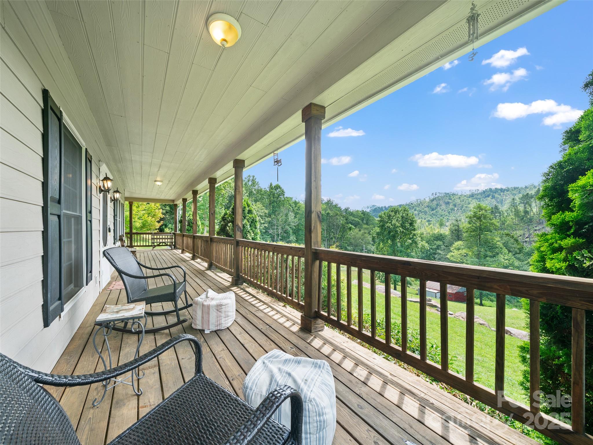 2216 Beans Creek Road Bakersville, NC 28705 - Photo 2 of 39 a balcony with chairs