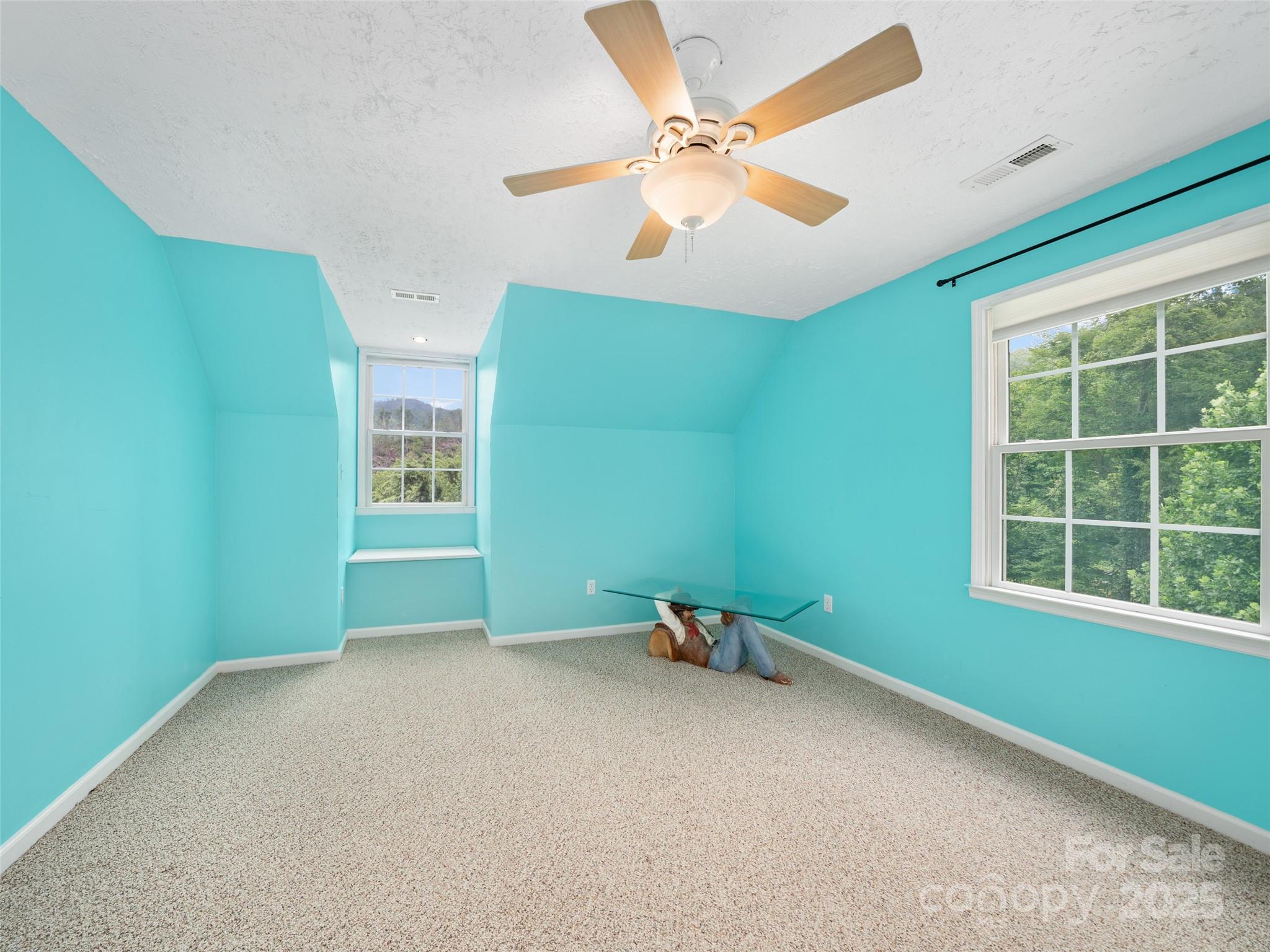 2216 Beans Creek Road Bakersville, NC 28705 - Photo 24 of 39 an empty room with a window and ceiling fan