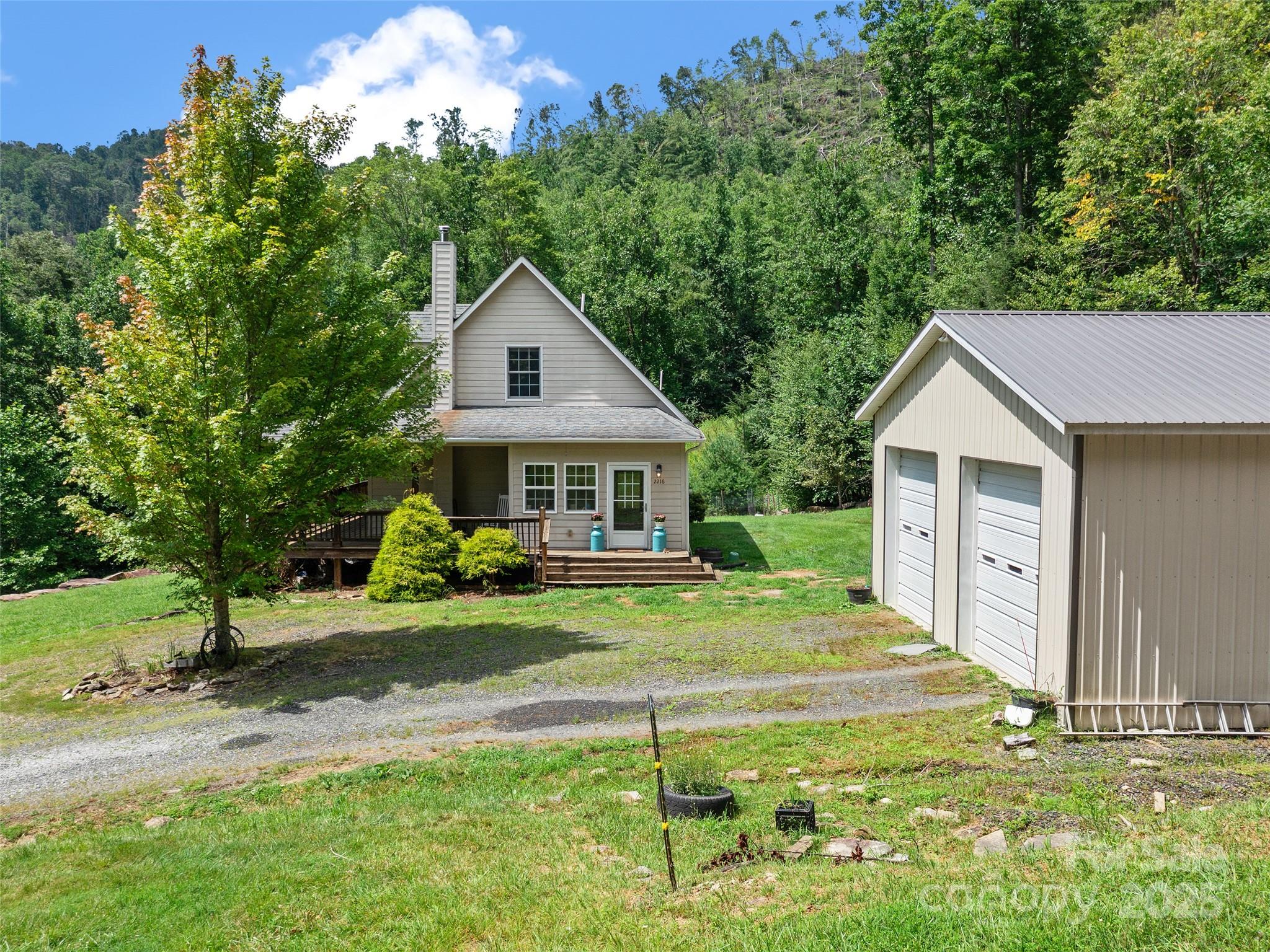 2216 Beans Creek Road Bakersville, NC 28705 - Photo 35 of 39 a front view of a house with garden