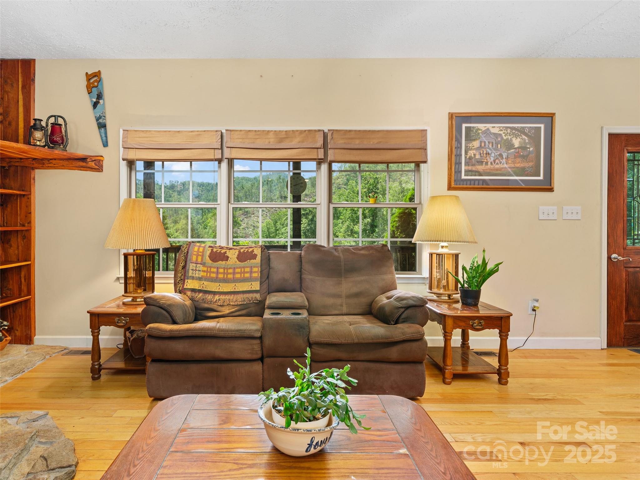 2216 Beans Creek Road Bakersville, NC 28705 - Photo 5 of 39 a living room with furniture and a large window