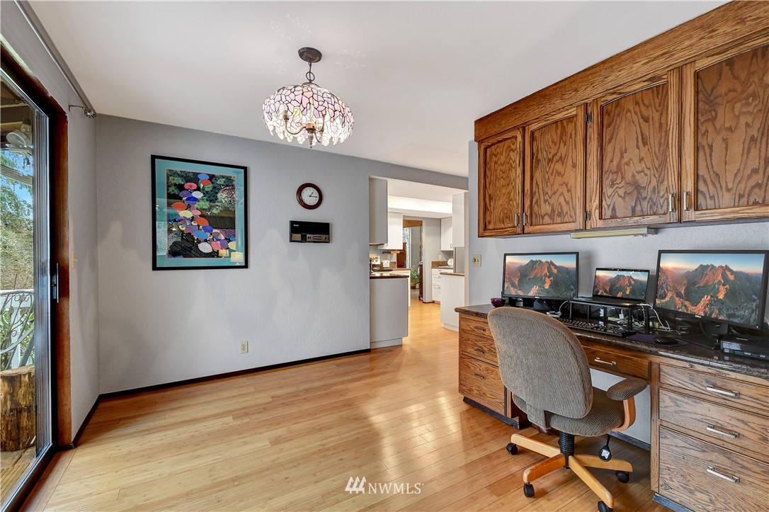 22217 61st Avenue Southeast Bothell, WA 98021 - Photo 13 of 37 a workspace with wooden floor and a window
