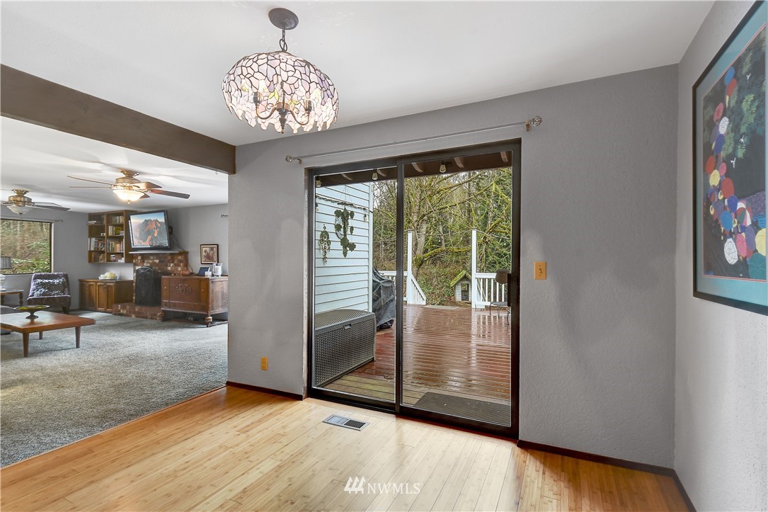 22217 61st Avenue Southeast Bothell, WA 98021 - Photo 14 of 37 a view of a livingroom with furniture wooden floor and a chandelier