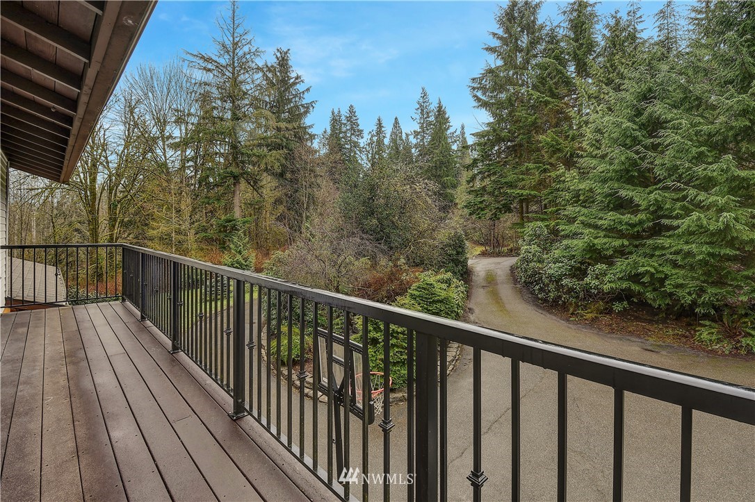 22217 61st Avenue Southeast Bothell, WA 98021 - Photo 19 of 37 a view of a balcony with wooden floor and fence