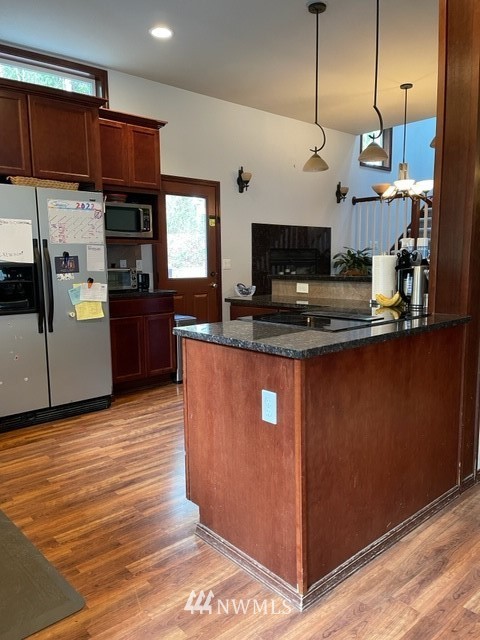 22217 61st Avenue Southeast Bothell, WA 98021 - Photo 33 of 37 a kitchen with stainless steel appliances granite countertop a sink a stove and a refrigerator