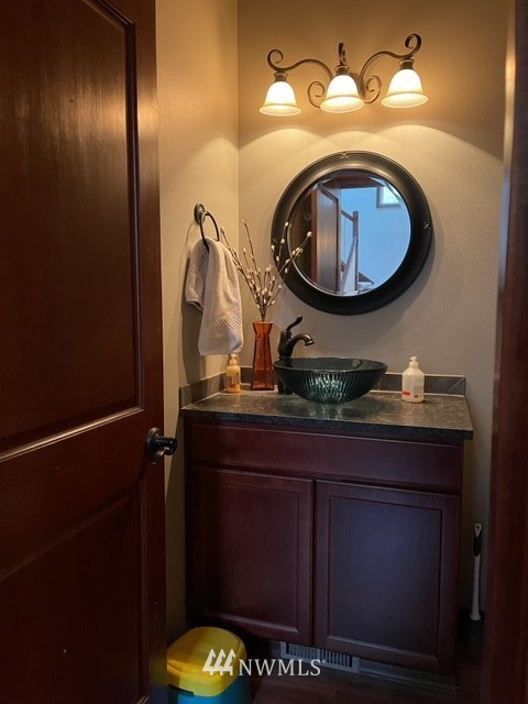 22217 61st Avenue Southeast Bothell, WA 98021 - Photo 34 of 37 a bathroom with a sink and a mirror