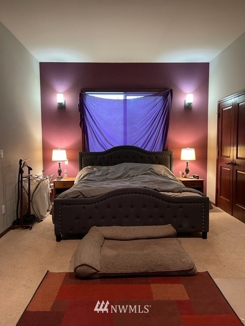 22217 61st Avenue Southeast Bothell, WA 98021 - Photo 35 of 37 a bedroom with a bed and a lamp