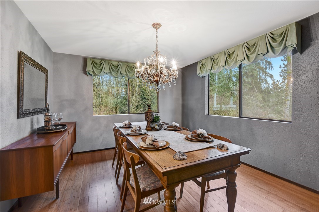 22217 61st Avenue Southeast Bothell, WA 98021 - Photo 9 of 37 a view of a dining room with furniture window and outside view