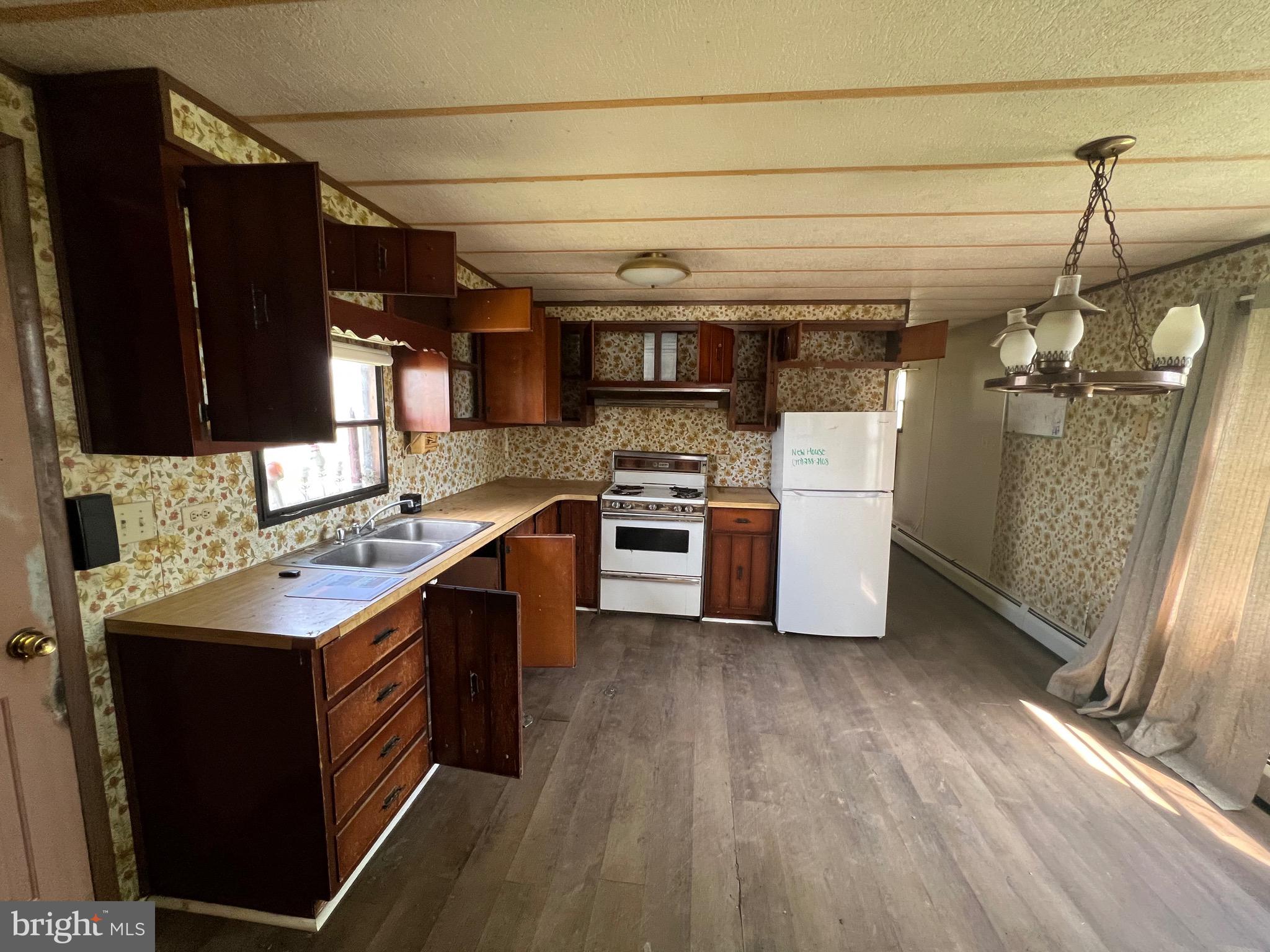 2318 Rockvale Road Lancaster, PA 17602 - Photo 2 of 15 a kitchen with a stove and a refrigerator