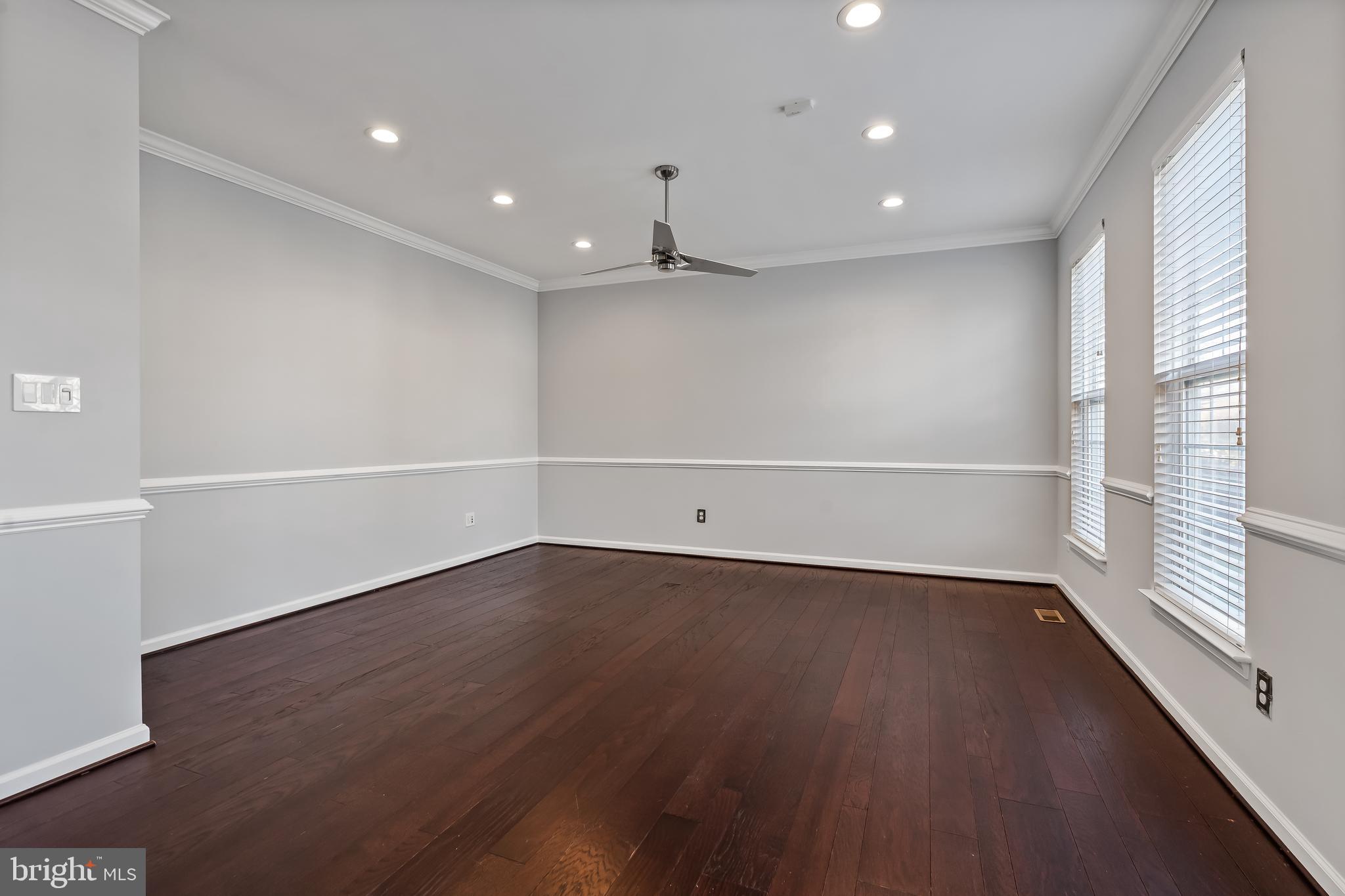 43112 Demerrit Street Chantilly, VA 20152 - Photo 19 of 42 an empty room with wooden floor and windows