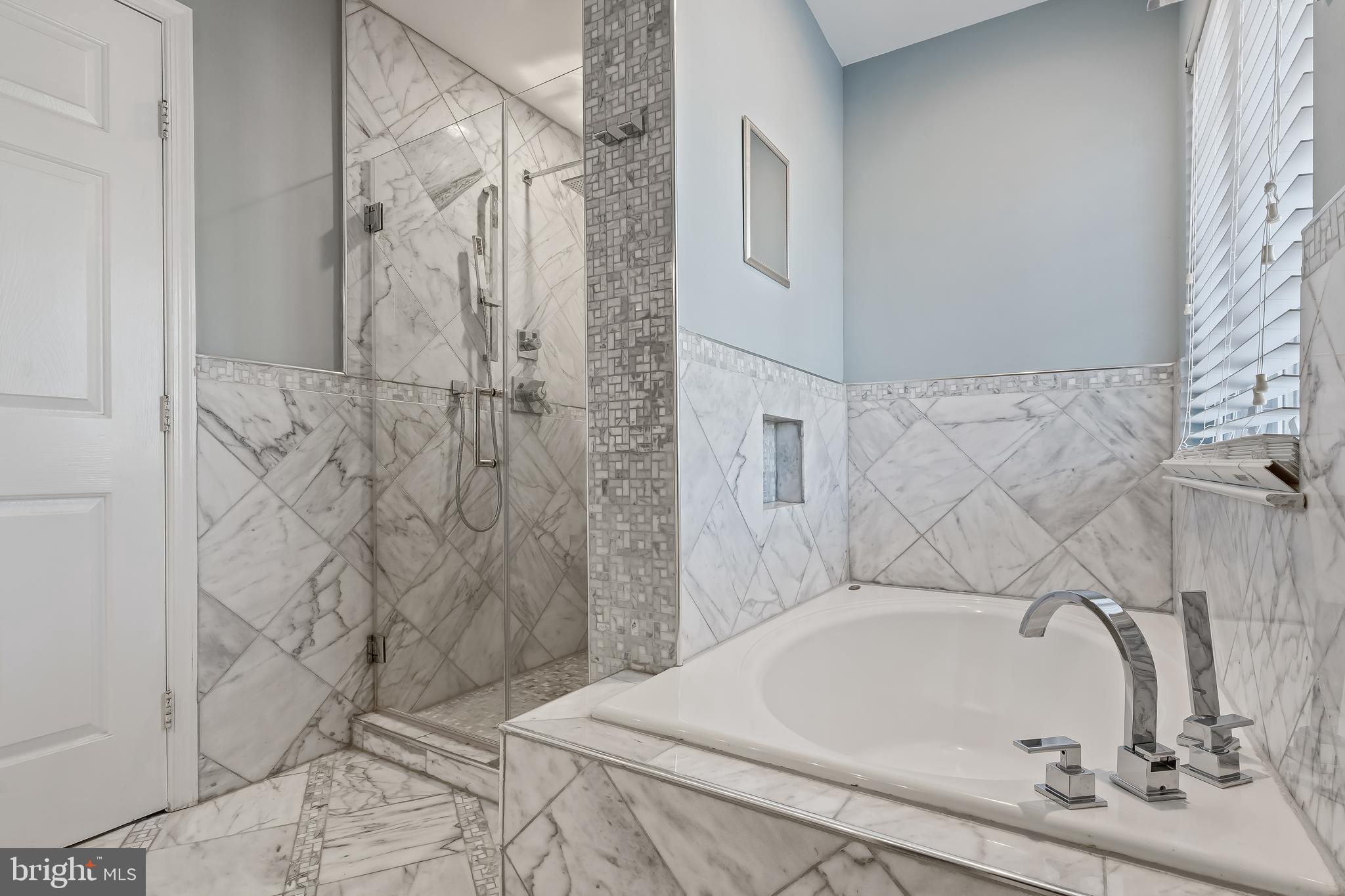 43112 Demerrit Street Chantilly, VA 20152 - Photo 26 of 42 a bathroom with a bathtub and shower