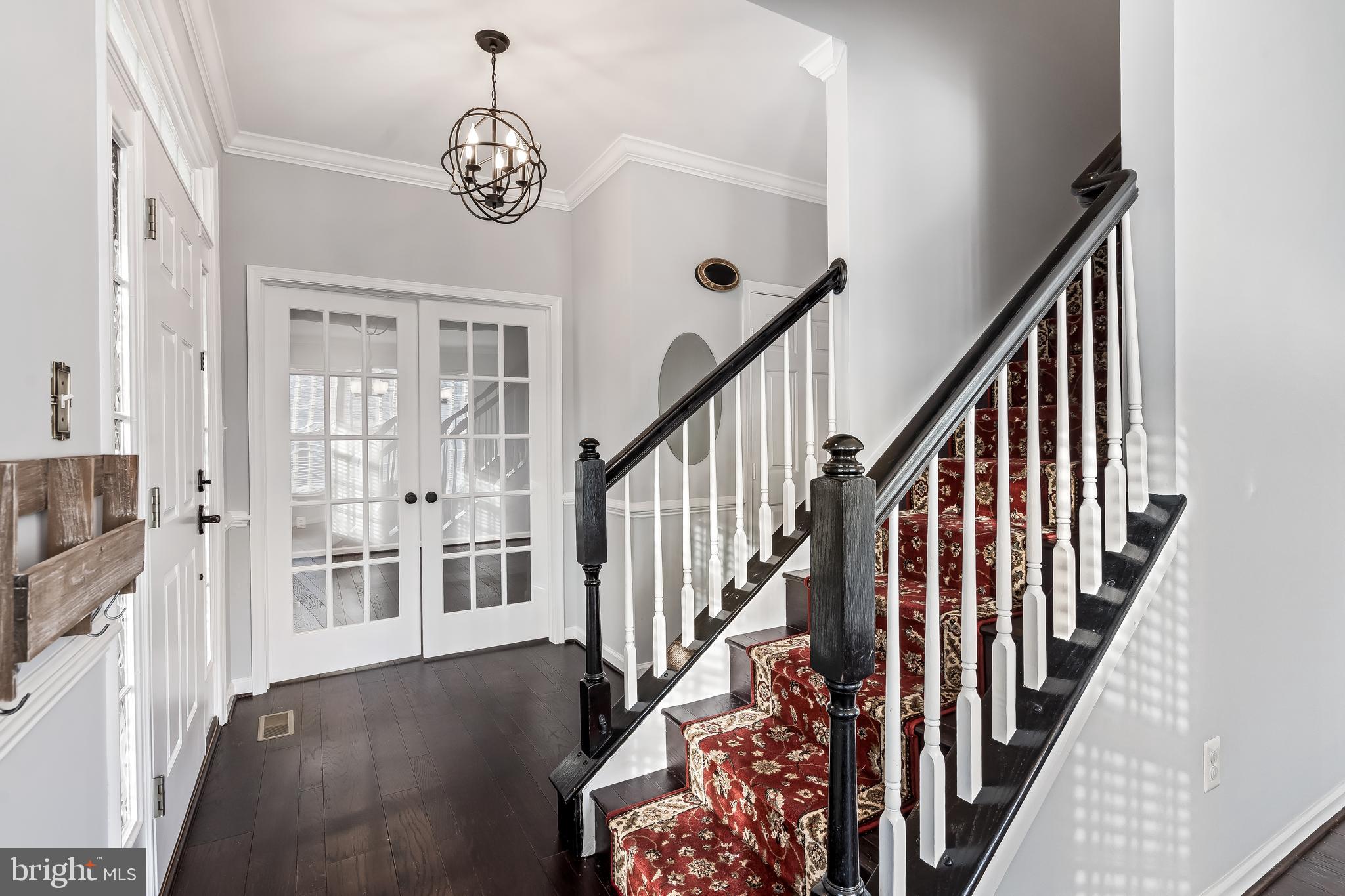 43112 Demerrit Street Chantilly, VA 20152 - Photo 3 of 42 a view of an entryway with wooden floor
