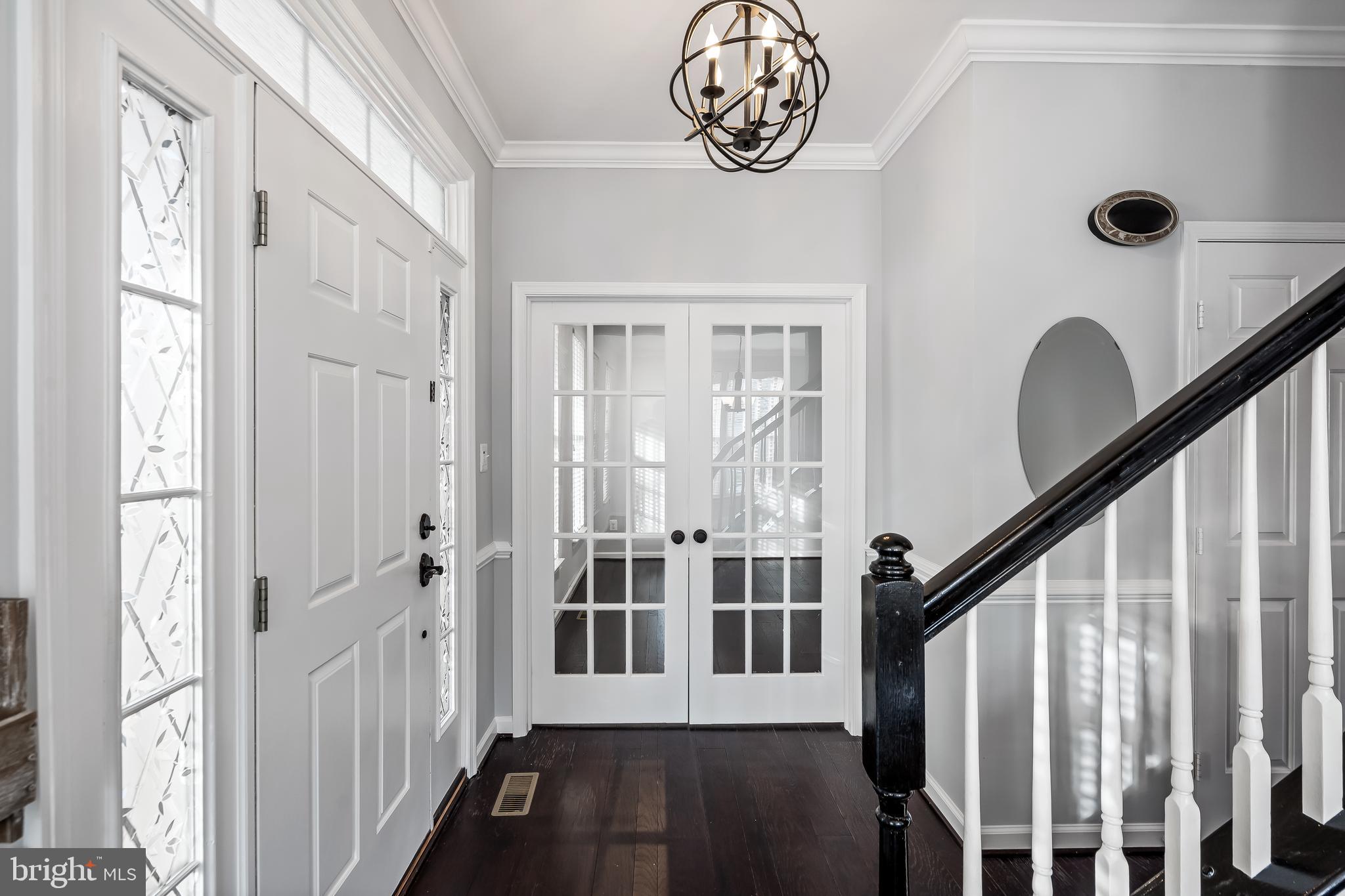43112 Demerrit Street Chantilly, VA 20152 - Photo 6 of 42 a view of a hallway with wooden floor and entryway