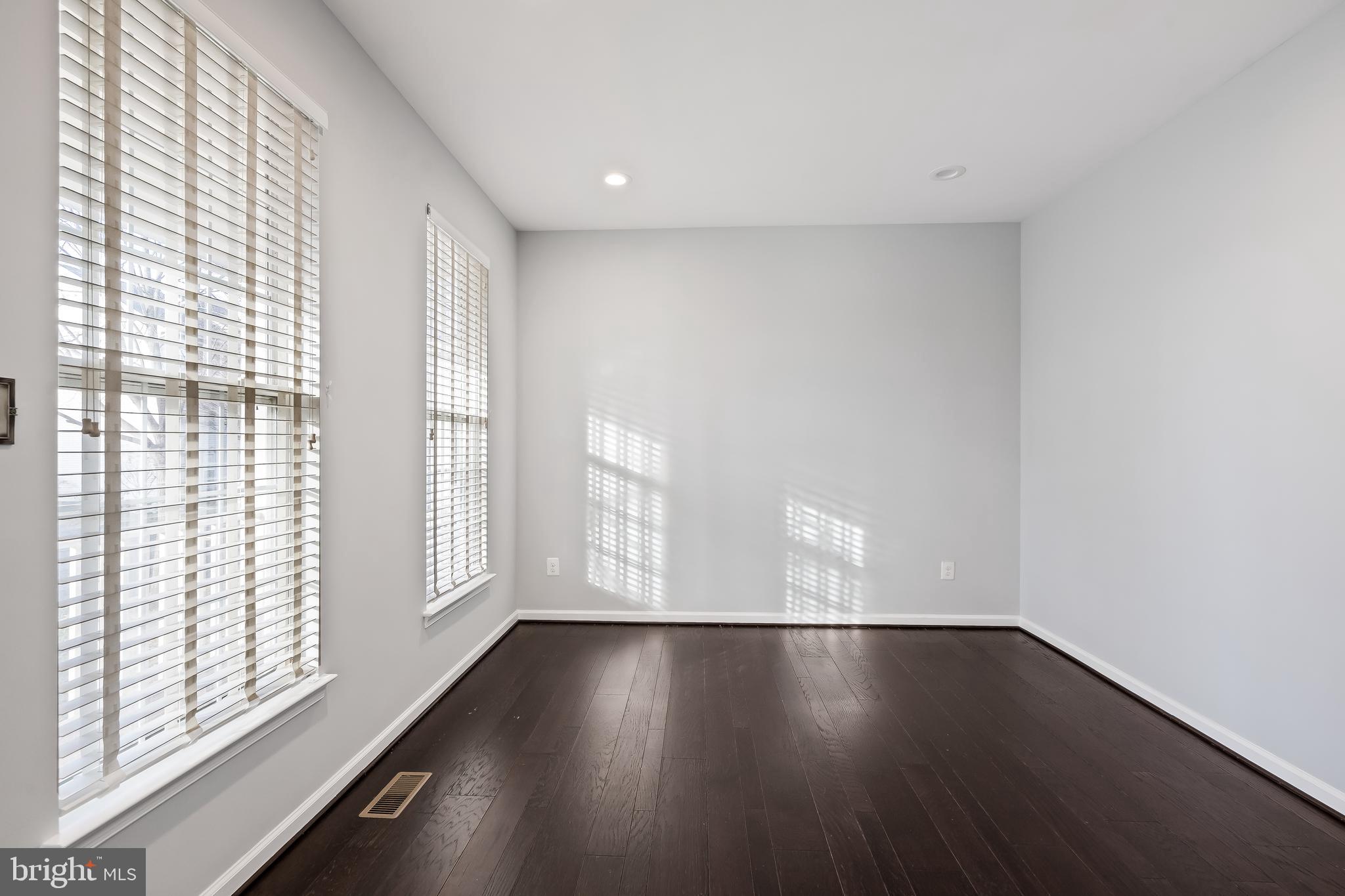 43112 Demerrit Street Chantilly, VA 20152 - Photo 7 of 42 a view of empty room with wooden floor and fan