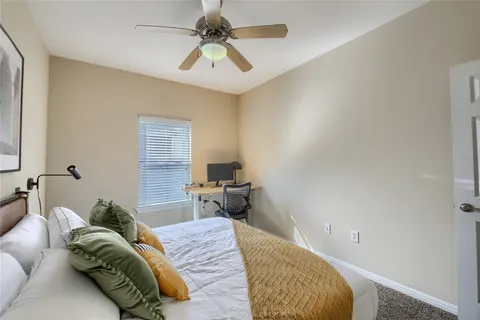 a bedroom with a bed furniture and a window