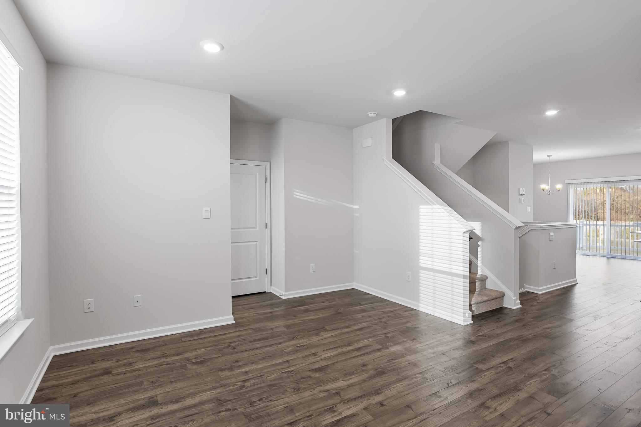 10 Sisters Farmstead Road Mount Laurel, NJ 08054 - Photo 11 of 35 an empty room with wooden floor and windows
