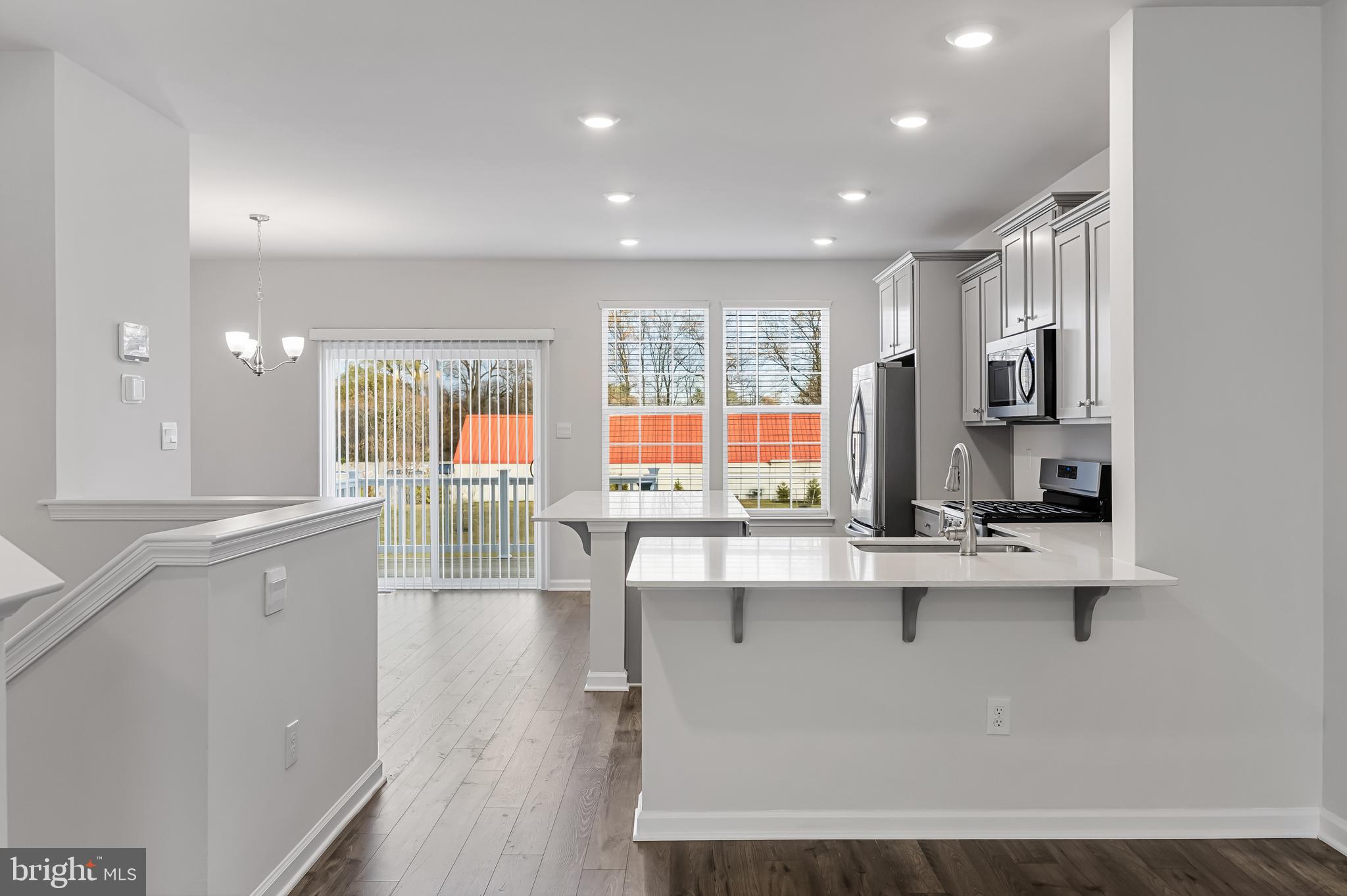 10 Sisters Farmstead Road Mount Laurel, NJ 08054 - Photo 13 of 35 a kitchen with stainless steel appliances a sink stove and cabinets