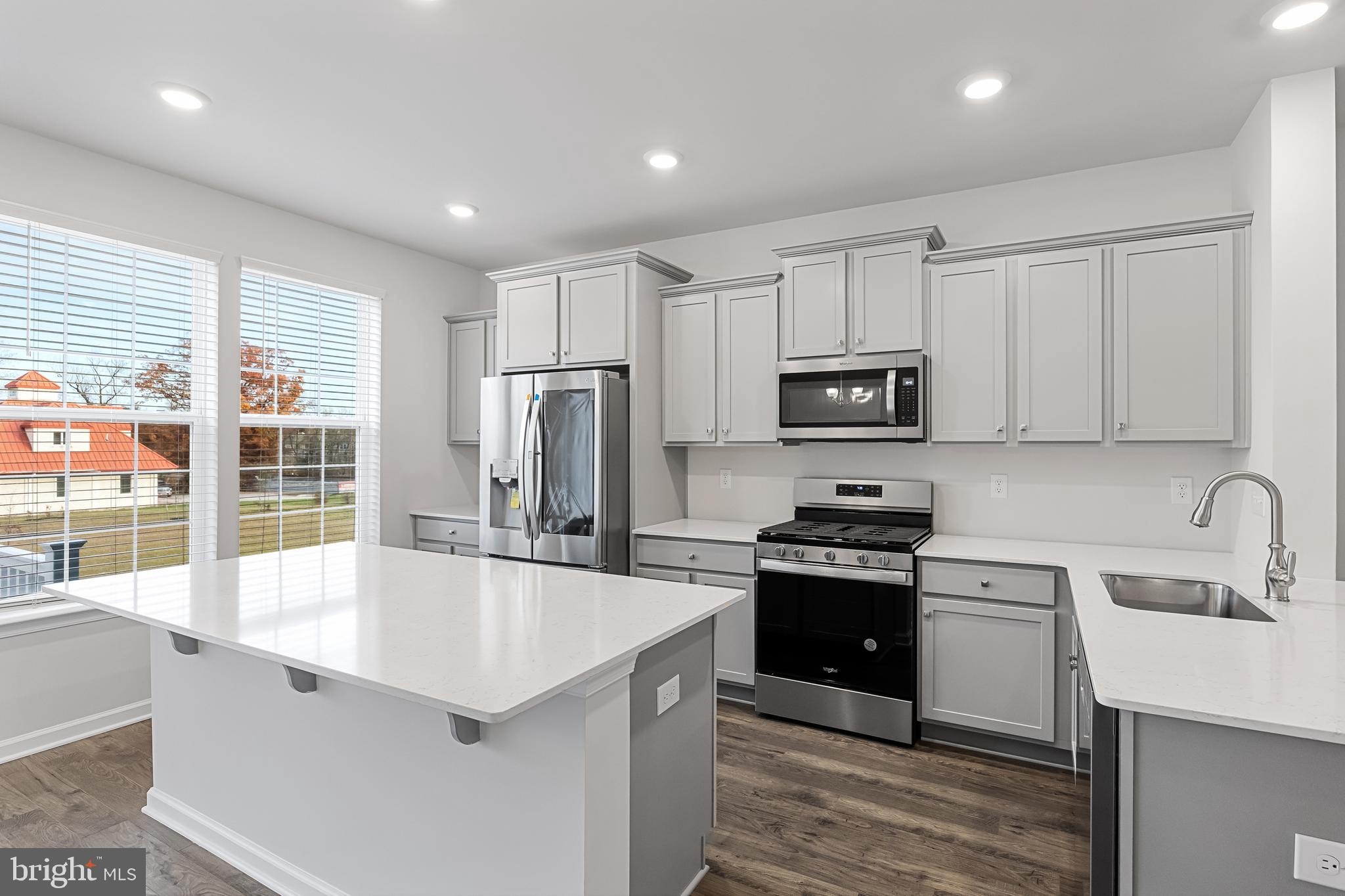 10 Sisters Farmstead Road Mount Laurel, NJ 08054 - Photo 14 of 35 a kitchen with granite countertop a sink stove and refrigerator