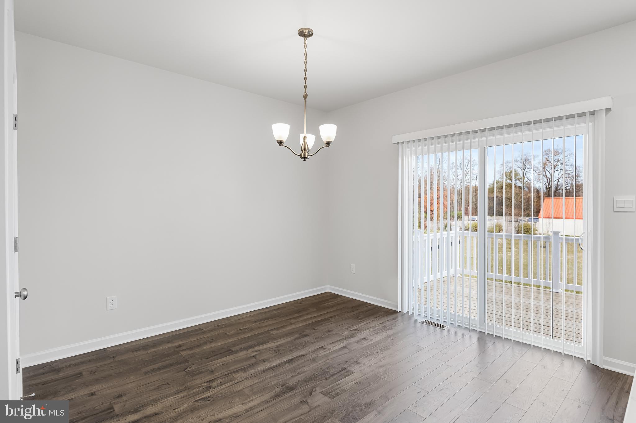 10 Sisters Farmstead Road Mount Laurel, NJ 08054 - Photo 18 of 35 a view of a room with wooden floor chandelier and windows