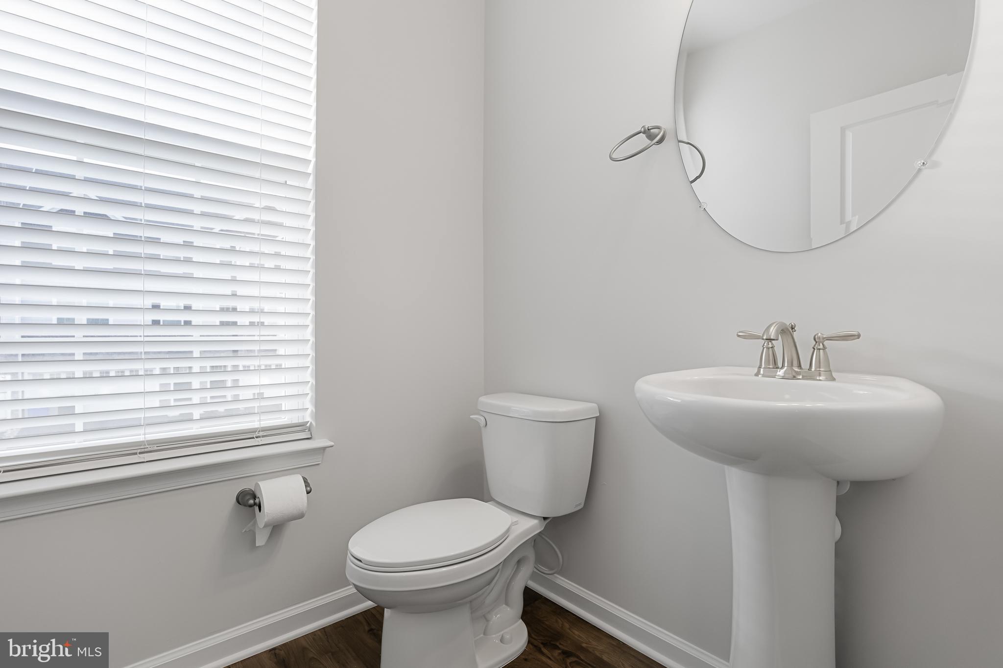 10 Sisters Farmstead Road Mount Laurel, NJ 08054 - Photo 19 of 35 a bathroom with a sink a mirror and a toilet