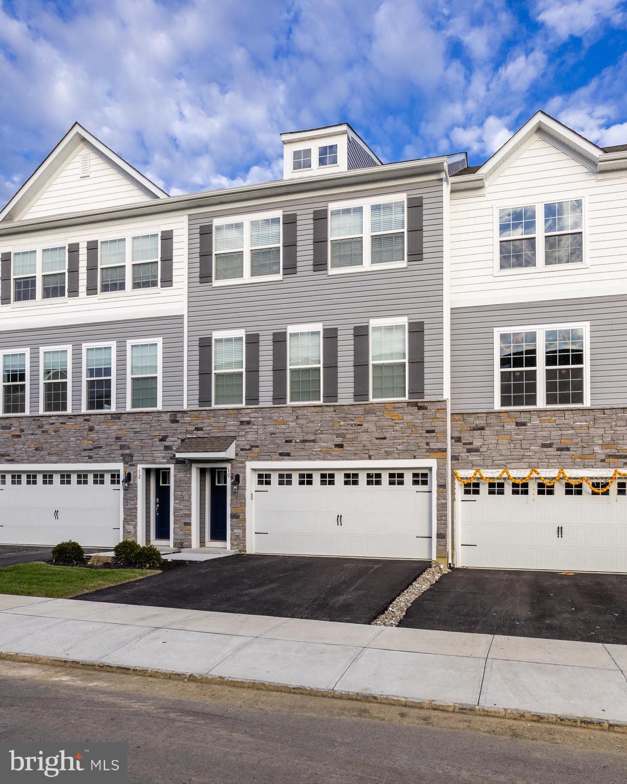 10 Sisters Farmstead Road Mount Laurel, NJ 08054 - Photo 2 of 35 a view of a white building among the street with building