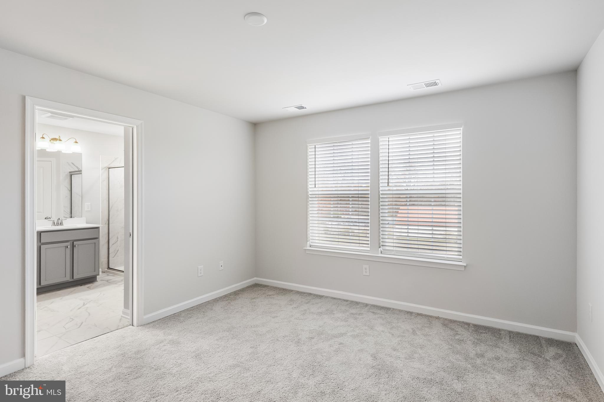 10 Sisters Farmstead Road Mount Laurel, NJ 08054 - Photo 23 of 35 a view of an empty room with a window and a kitchen