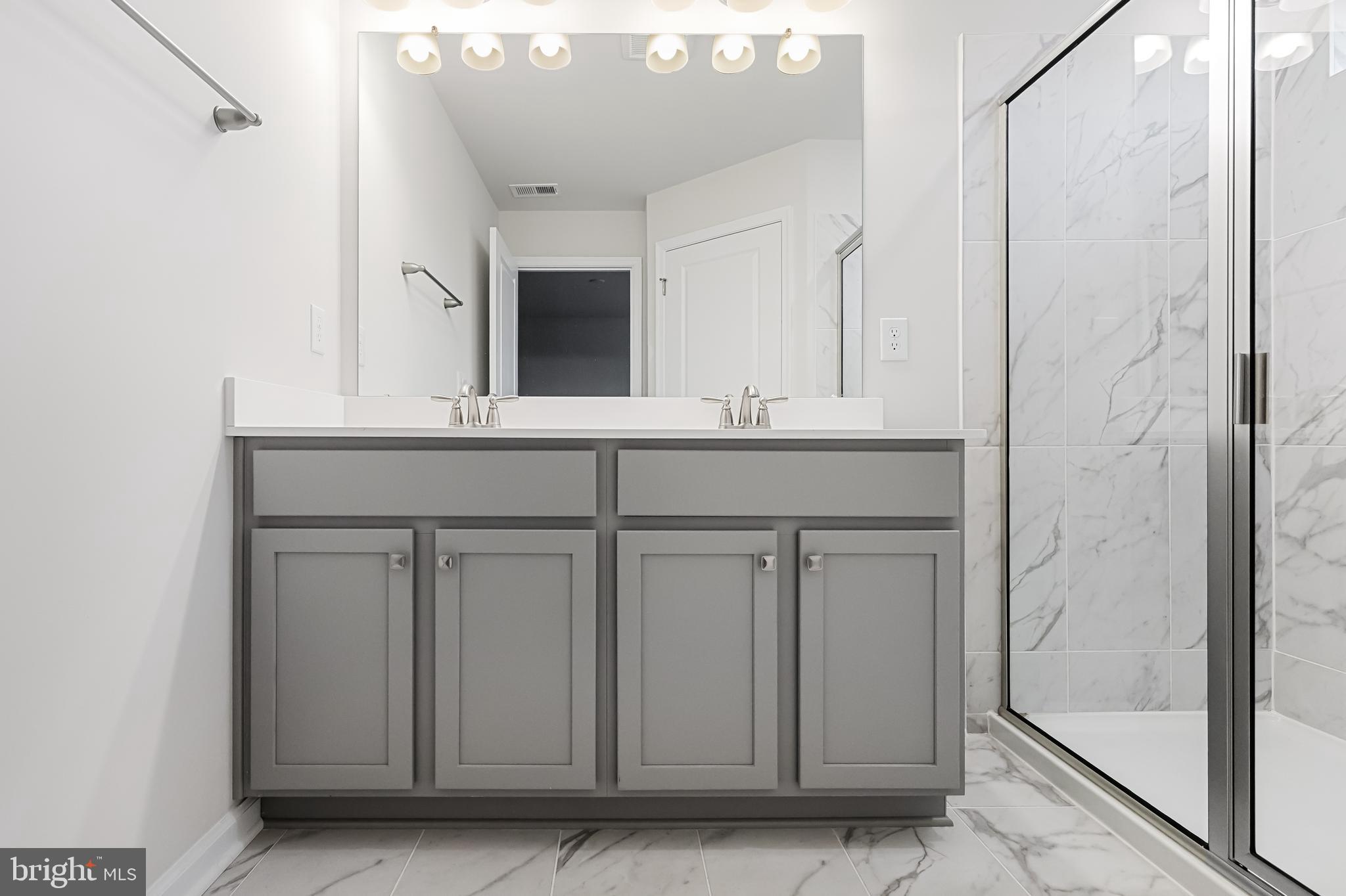 10 Sisters Farmstead Road Mount Laurel, NJ 08054 - Photo 24 of 35 a bathroom with a sink and a mirror