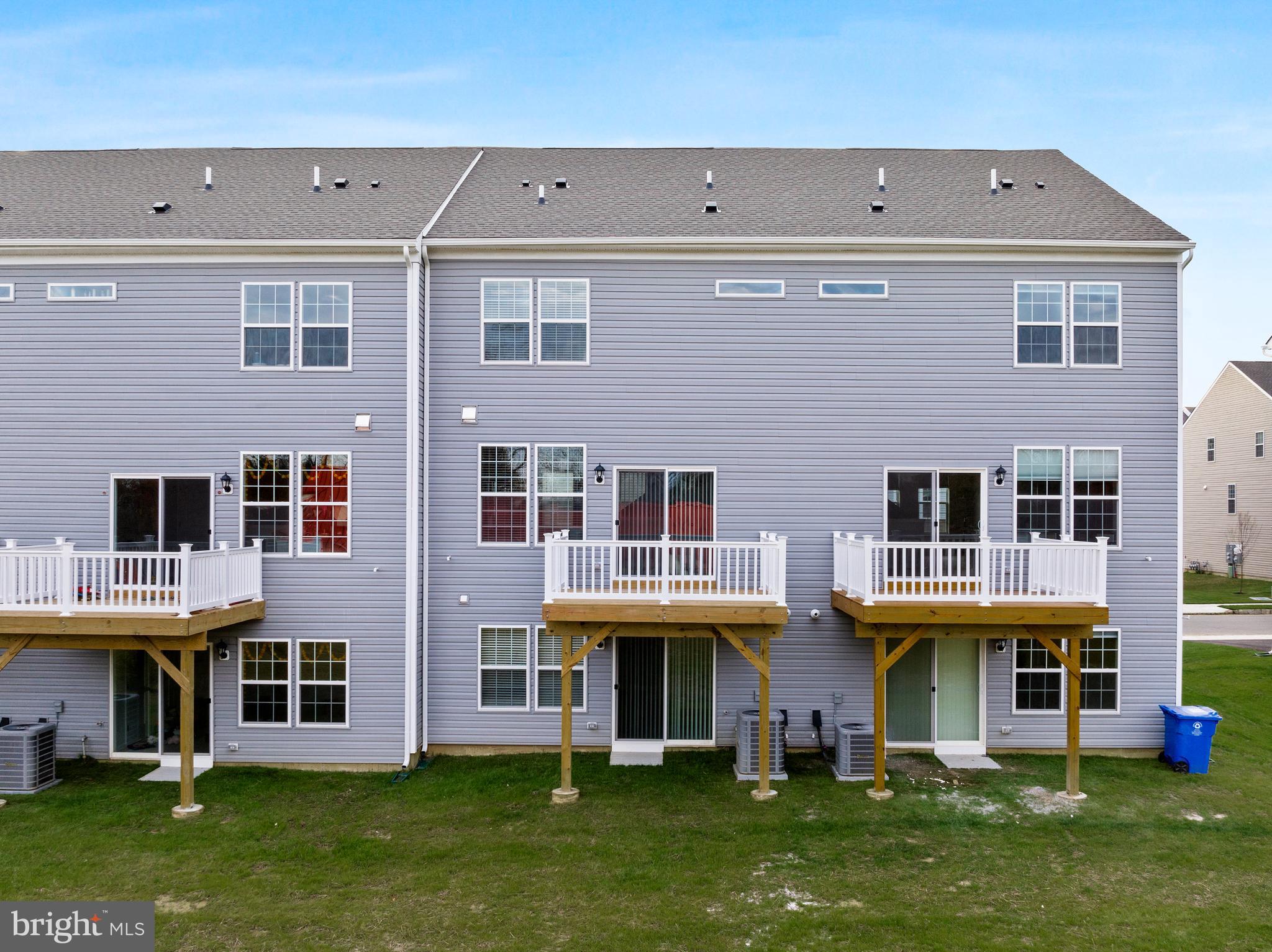 10 Sisters Farmstead Road Mount Laurel, NJ 08054 - Photo 31 of 35 a view of an apartment with many windows and a yard