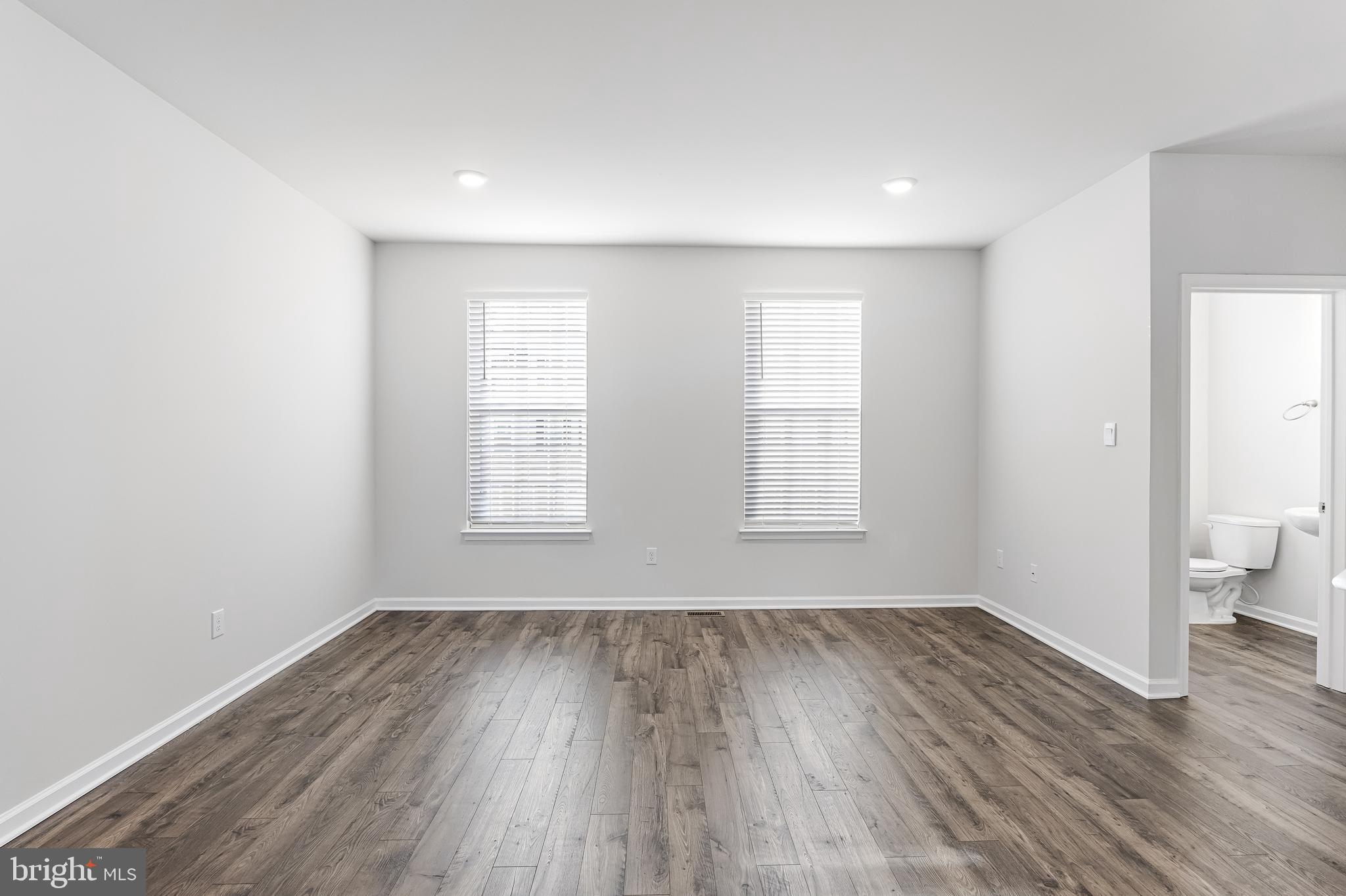 10 Sisters Farmstead Road Mount Laurel, NJ 08054 - Photo 10 of 35 an empty room with wooden floor and a window