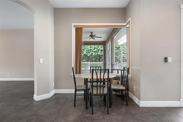 a view of a dining room with furniture window and outside view