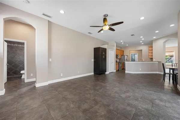 a view of a livingroom with furniture and a ceiling fan