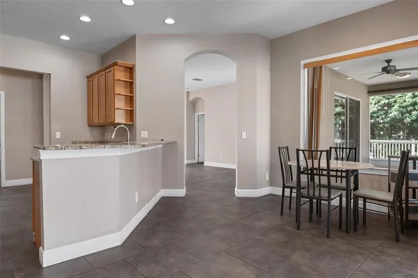 a view of a dining room with furniture and window