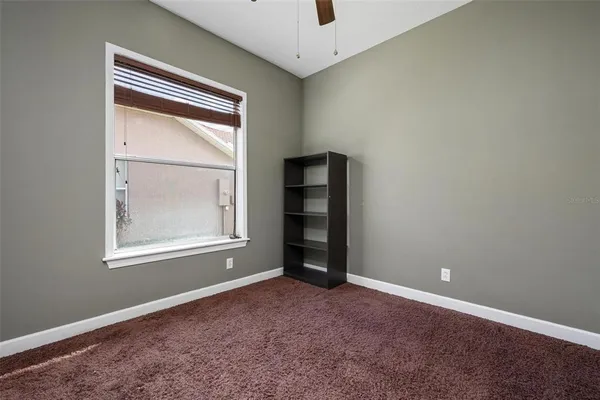 an empty room with a empty space and windows