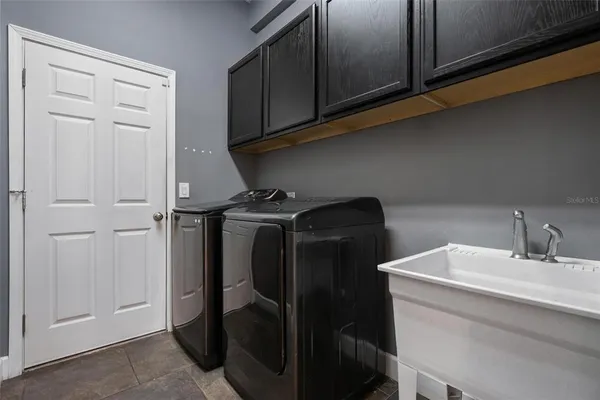 a bathroom with a sink and cabinets