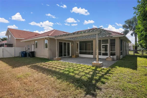 a front view of a house with a garden and yard