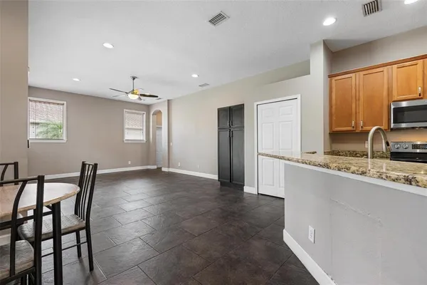 a view of a kitchen cabinets and dining room