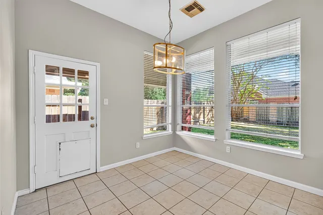 a view of an empty room with windows