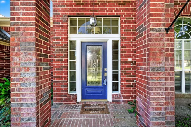a view of a brick building with many windows
