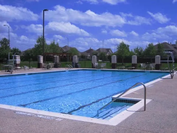 a childrens park with lots of swings and slides