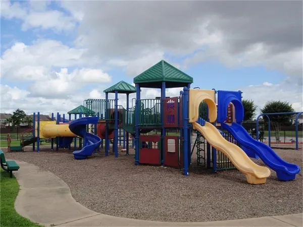a swimming pool with outdoor seating and yard